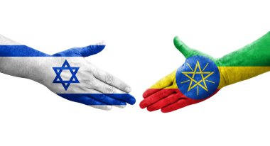 Etiyopya ve İsrail bayrakları arasındaki el sıkışma ellerinde resmedilmiş şeffaf görüntü.