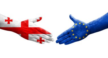 Avrupa Birliği ve Gürcistan bayrakları arasındaki tokalaşma el sıkışması, izole şeffaf görüntü.