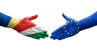 Avrupa Birliği ve Seyşeller arasındaki el sıkışma ellerinde boyanmış bayraklar, izole şeffaf görüntü.