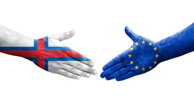 Avrupa Birliği ve Faroe Adaları bayrakları arasındaki el sıkışma, izole şeffaf görüntü.