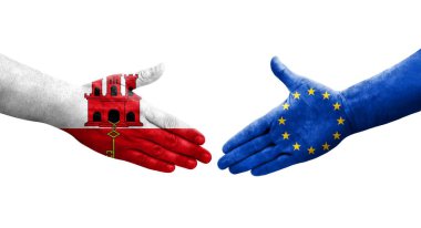 Avrupa Birliği ile Cebelitarık bayrakları arasındaki el sıkışma, izole şeffaf görüntü.