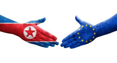 Avrupa Birliği ve Kuzey Kore bayrakları arasındaki el sıkışma, izole şeffaf görüntü.