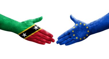 Avrupa Birliği ile Saint Kitts ve Nevis bayrakları arasındaki el sıkışma, izole şeffaf görüntü.
