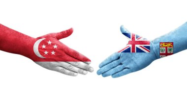 Fiji ve Singapur bayrakları arasındaki el sıkışma ellere boyanmış, izole şeffaf görüntü.