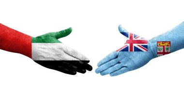 Fiji ve BAE bayrakları arasındaki el sıkışma, izole edilmiş şeffaf görüntü.