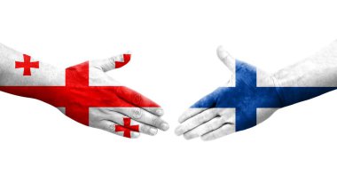 Finlandiya ve Gürcistan bayrakları arasındaki el sıkışma el yazısı, izole şeffaf görüntü.