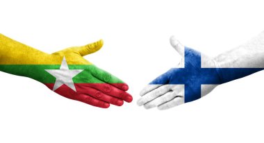 Finlandiya ve Myanmar bayrakları arasındaki el sıkışma ellere boyanmış, izole şeffaf görüntü.