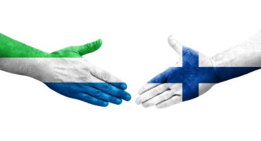 Finlandiya ile Sierra Leone bayrakları arasındaki el sıkışma ellere boyanmış, izole şeffaf görüntü.