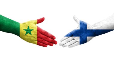 Finlandiya ile Senegal bayrakları arasındaki el sıkışma, izole edilmiş şeffaf resim.