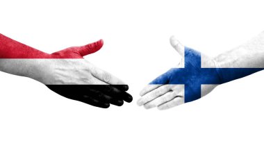 Finlandiya ve Yemen bayrakları arasındaki el sıkışma ellere boyanmış, izole şeffaf görüntü.