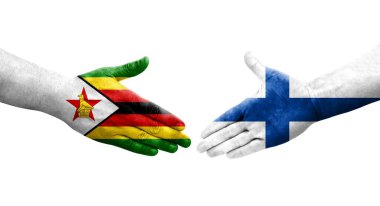 Finlandiya ile Zimbabwe bayrakları arasındaki el sıkışma, izole edilmiş şeffaf görüntü.