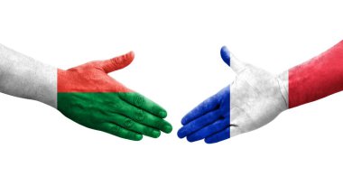 Fransa ve Madagaskar bayrakları arasındaki el sıkışma, izole edilmiş şeffaf görüntü.