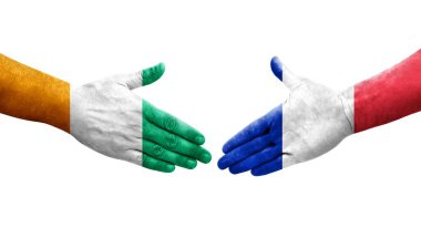 Fransa ve Fildişi Sahili bayrakları arasındaki el sıkışma, izole şeffaf görüntü.