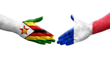 Fransa ve Zimbabwe bayrakları arasında el sıkışma, izole şeffaf görüntü.