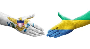Gabon ve Virgin Adaları arasındaki el sıkışma ellerinde boyanmış bayraklar, izole şeffaf görüntü.