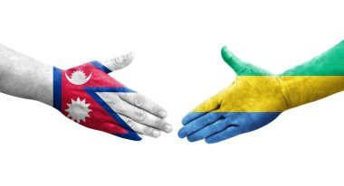 Gabon ve Nepal bayrakları arasındaki el sıkışma ellerinde resmedilmiş şeffaf görüntü.
