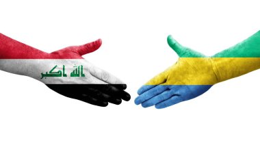 Gabon ve Irak bayrakları arasında el sıkışma, izole şeffaf görüntü.