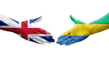 Gabon ve Büyük Britanya arasındaki el sıkışma ellerinde bayraklar, izole edilmiş şeffaf görüntü.