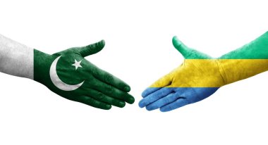 Gabon ve Pakistan bayrakları arasındaki el sıkışma ellerinde resmedilmiş şeffaf bir görüntü.