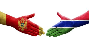 Gambiya ve Karadağ bayrakları arasındaki el sıkışma, izole şeffaf görüntü.
