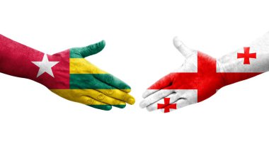 Ellerinde Gürcistan ve Togo bayrakları arasında el sıkışma, izole şeffaf görüntü.