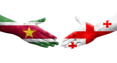 Gürcistan ve Surinam bayrakları arasındaki el sıkışma, izole şeffaf görüntü.