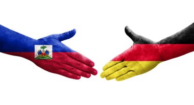 Almanya ile Haiti bayrakları arasındaki el sıkışma, izole şeffaf görüntü.