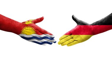 Almanya ile Kiribati bayrakları arasındaki el sıkışma, izole şeffaf görüntü.