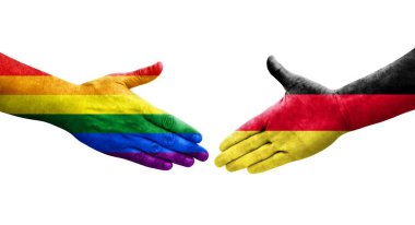 Almanya ile LGBT bayrakları arasındaki el sıkışma, izole edilmiş şeffaf görüntü.
