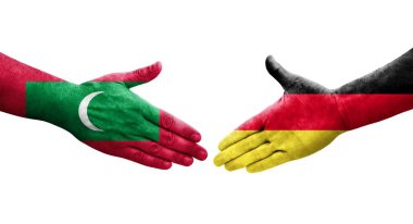 Almanya ile Maldivler arasındaki el sıkışma ellerinde bayraklar, izole edilmiş şeffaf görüntü.