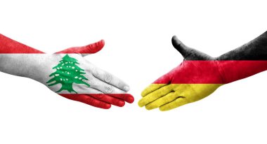 Almanya ile Lübnan bayrakları arasında el sıkışma, izole şeffaf görüntü.