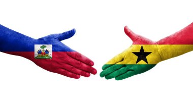 Gana ve Haiti bayrakları arasındaki el sıkışma ellerinde resmedilmiş şeffaf görüntü.