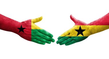 Gana ve Gine Bissau bayrakları arasındaki tokalaşma ellerinde izole şeffaf görüntü.
