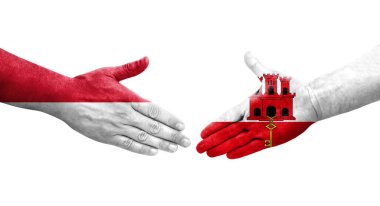 Cebelitarık ve Monaco bayrakları arasında el sıkışma..