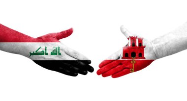 Cebelitarık ve Irak bayrakları arasında el sıkışma, izole edilmiş şeffaf görüntü.