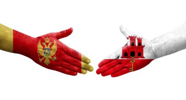 Cebelitarık ile Karadağ bayrakları arasındaki el sıkışma, izole edilmiş şeffaf görüntü.