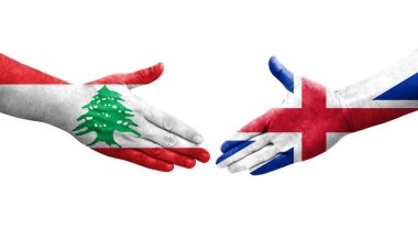 Büyük Britanya ve Lübnan bayrakları arasındaki el sıkışma ellere boyanmış, izole şeffaf görüntü.