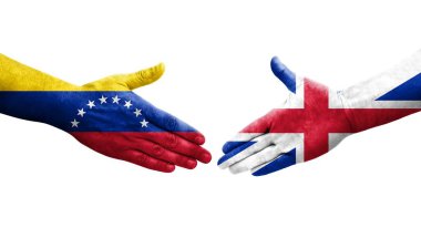 Büyük Britanya ve Venezuela bayrakları arasındaki el sıkışma ellerinde resmedilmiş şeffaf bir görüntü.