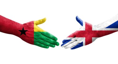 Büyük Britanya ve Gine Bissau bayrakları arasındaki el sıkışma..
