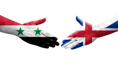 Büyük Britanya ve Suriye bayrakları arasındaki el sıkışma, izole şeffaf görüntü.