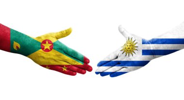 Grenada ve Uruguay bayrakları arasındaki el sıkışma ellerinde izole şeffaf görüntü.