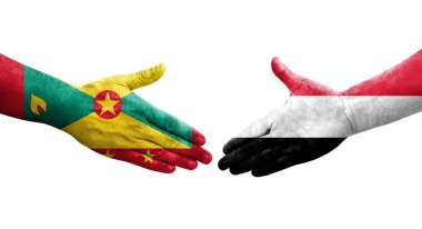 Grenada ve Yemen bayrakları arasındaki el sıkışma ellerinde resmedilmiş şeffaf görüntü.