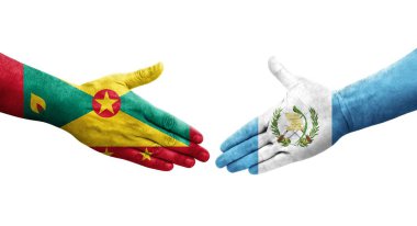 Grenada ve Guatemala bayrakları arasındaki el sıkışma ellerinde izole şeffaf görüntü.