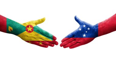 Grenada ve Samoa bayrakları arasındaki el sıkışma ellerinde izole şeffaf görüntü.