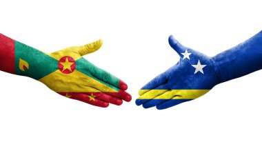 Grenada ve Curacao bayrakları arasındaki el sıkışma ellerinde izole şeffaf görüntü.