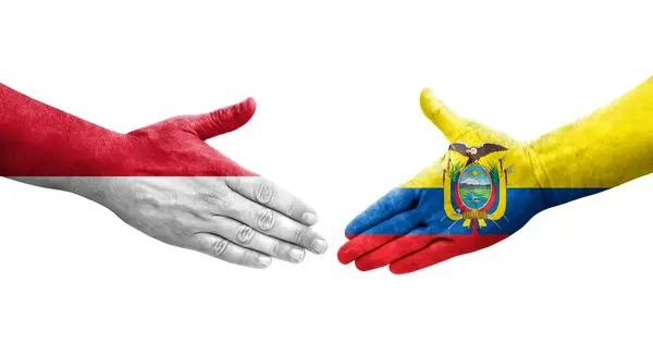 stock image Handshake between Ecuador and Monaco flags painted on hands, isolated transparent image.