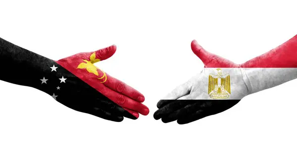 stock image Handshake between Egypt and Papua New Guinea flags painted on hands, isolated transparent image.