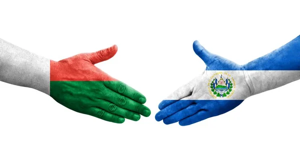 Χειραψία Μεταξύ Σαλβαδόρ Και Μαδαγασκάρη Σημαίες Ζωγραφισμένα Στα Χέρια Απομονωμένη — Φωτογραφία Αρχείου