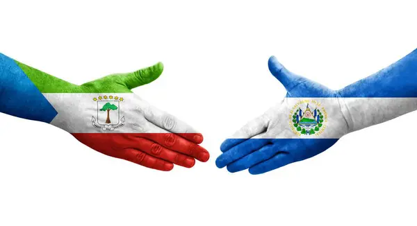 stock image Handshake between El Salvador and Equatorial Guinea flags painted on hands, isolated transparent image.