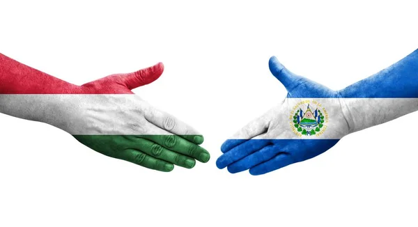 stock image Handshake between El Salvador and Hungary flags painted on hands, isolated transparent image.